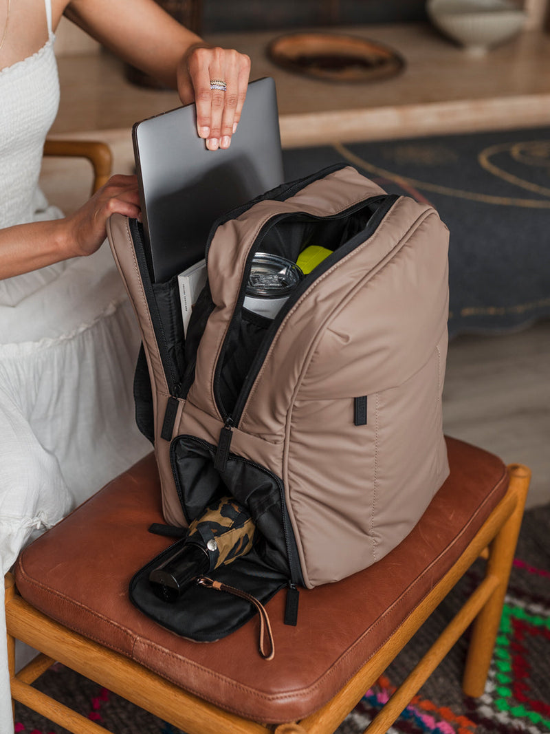 Brown Luka travel backpack with luggage sleeve and laptop pocket