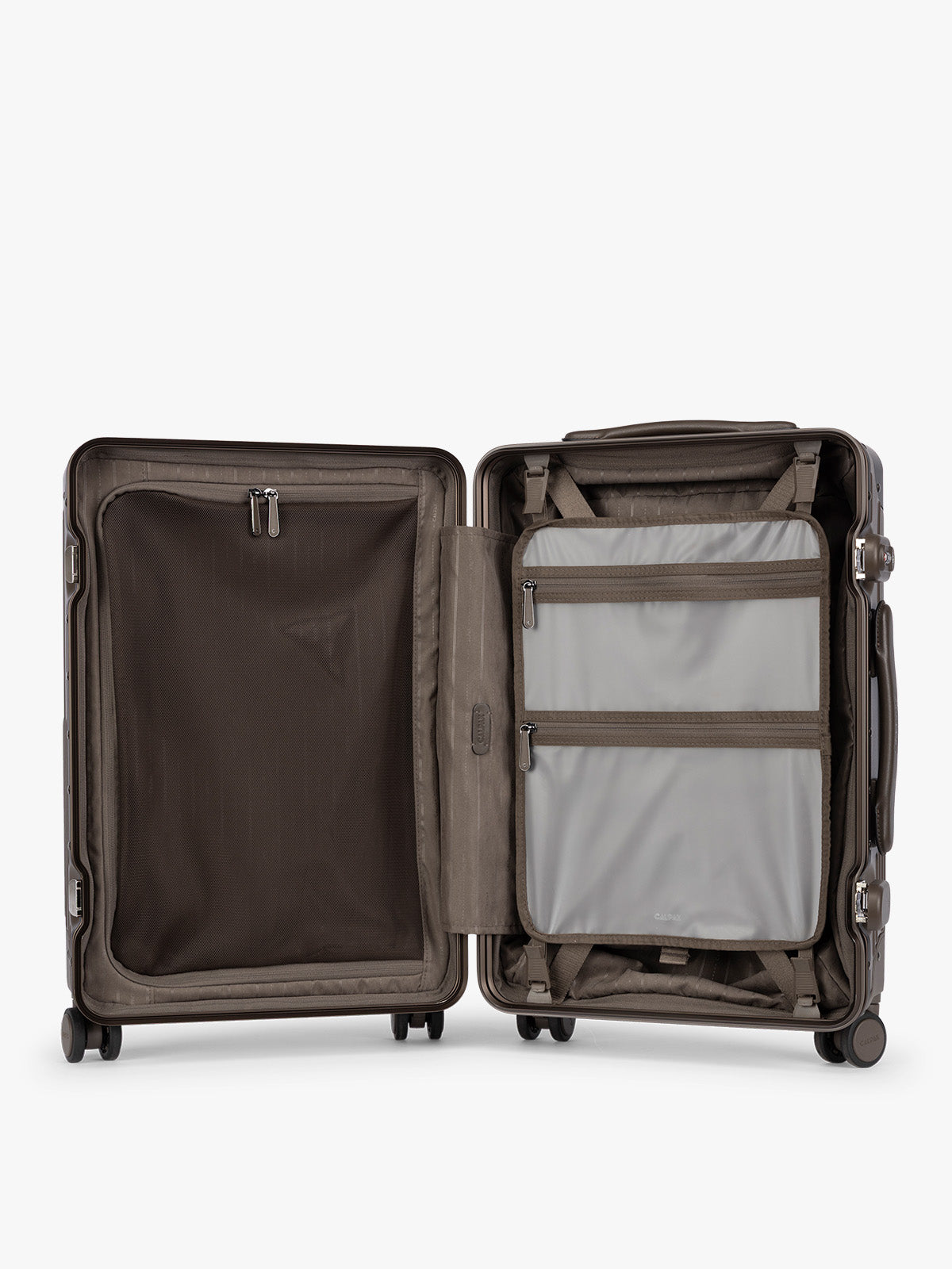 Opened showing grey zippered attachment of CALPAK Vault brown Mushroom hard-shell spinner Carry On Luggage with a telescoping handle extended, featuring a black leatherette side handle and trim, set against a plain light gray background; LVT1020-MUSHROOM