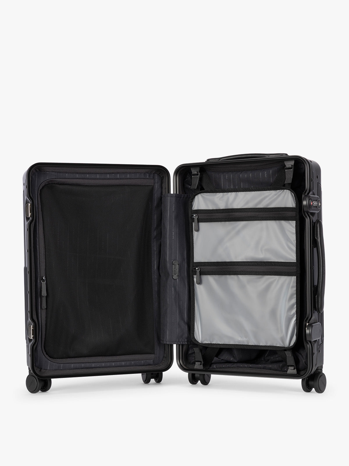 Opened showing the grey zipper attachment of CALPAK Vault black Onyx hard-shell spinner Carry On Luggage with a telescoping handle extended, featuring a Black leatherette side handle and trim, set against a plain light gray background; LVT1020-ONYX