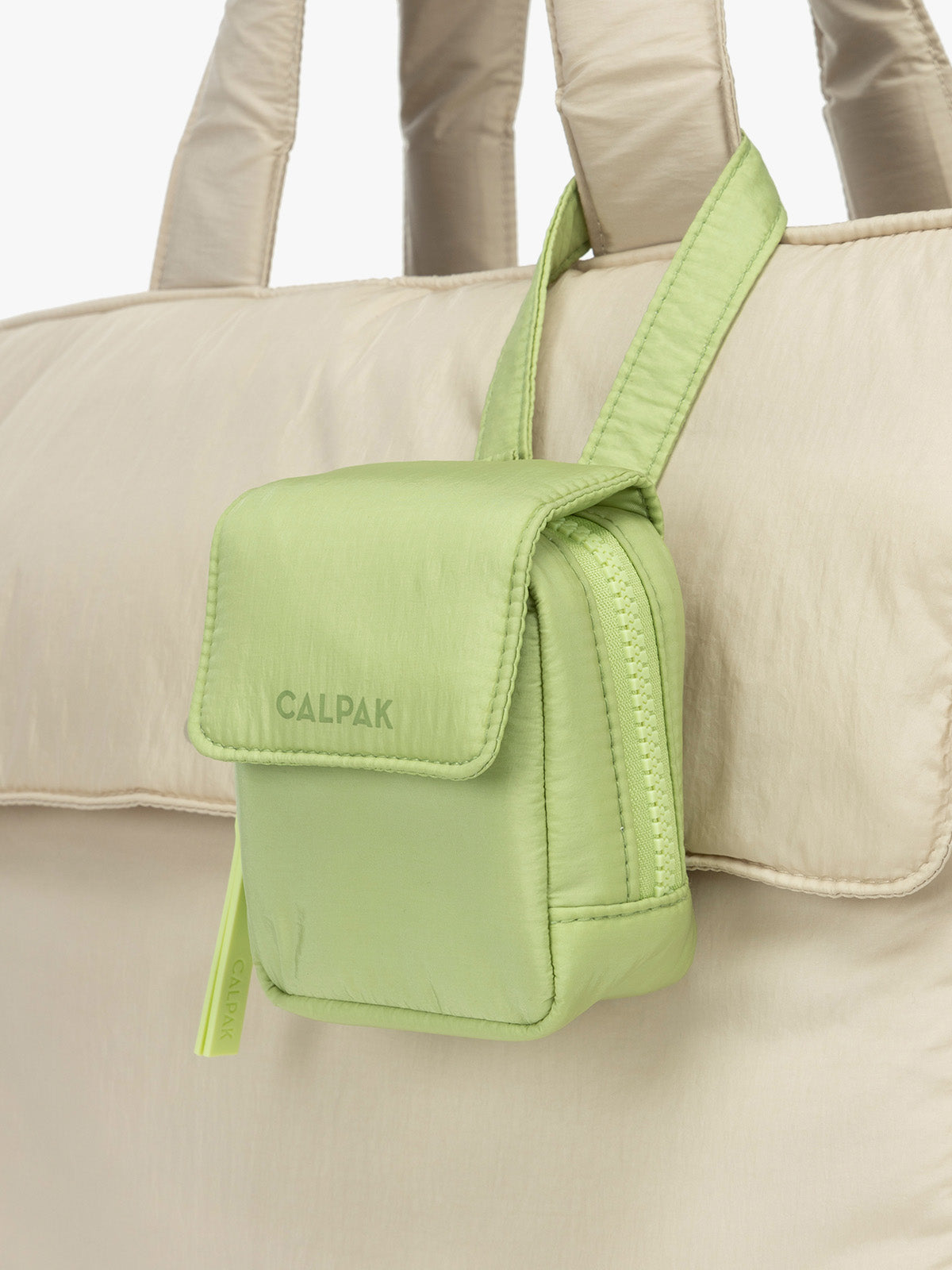 CALPAK Baby Collection Pacifier Pouch in light green Lime clipped onto white bag; PCB2501-LIME