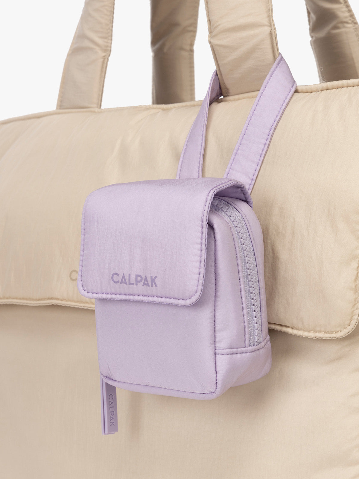 CALPAK Baby Collection Pacifier Pouch in lavender purple Orchid clipped onto white bag; PCB2501-ORCHID