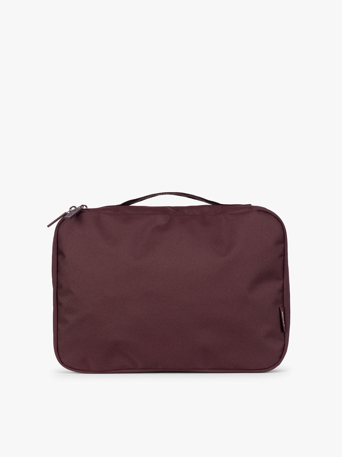 Closeup of a single Medium Compression Packing Cube in burgundy Dark Cherry CALPAK Medium Compression Packing Cubes with zippers shown on a clean white background; PCC2201-DARK-CHERRY
