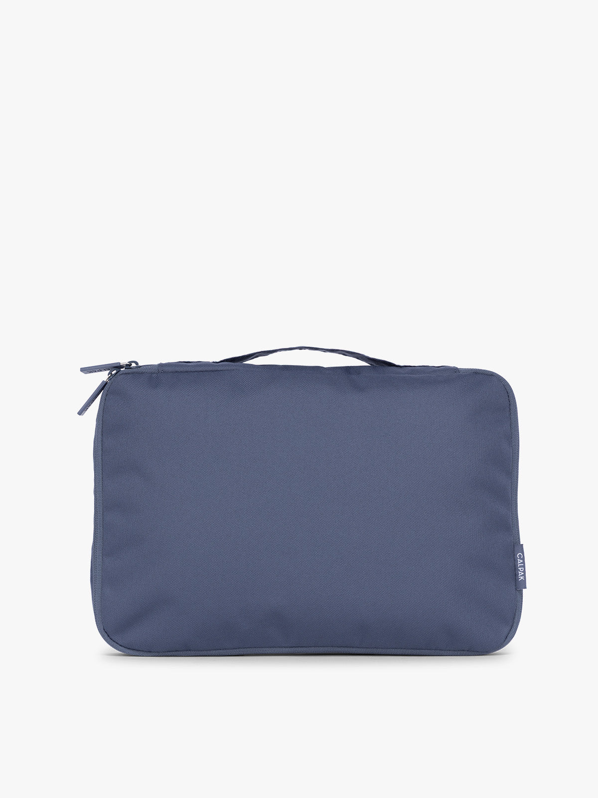 Front view of CALPAK Medium Compression Packing Cubes (Set of 2) compressed in dark blue Indigo; PCC2201-INDIGO