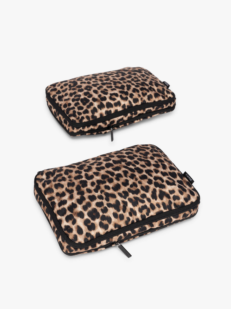 Two tan and black animal print Leopard CALPAK Medium Compression Packing Cubes with zippers shown on a clean white background; PCC2201-LEOPARD