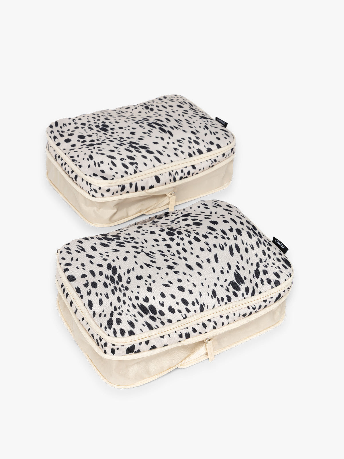 Two white and black animal print Snow Leopard CALPAK Medium Compression Packing Cubes with zippers shown on a clean white background shown uncompressed; PCC2201-SNOW-LEOPARD
