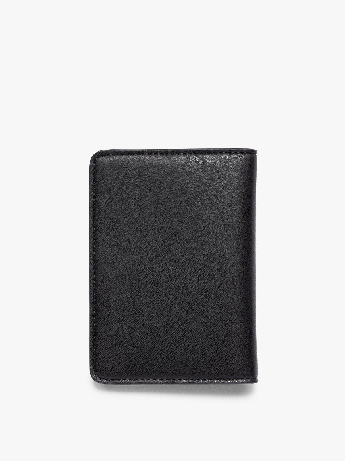 The back side view of black CALPAK Passport holder with visible stitching, photographed flat against a clean white background; PWTS2601-BLACK