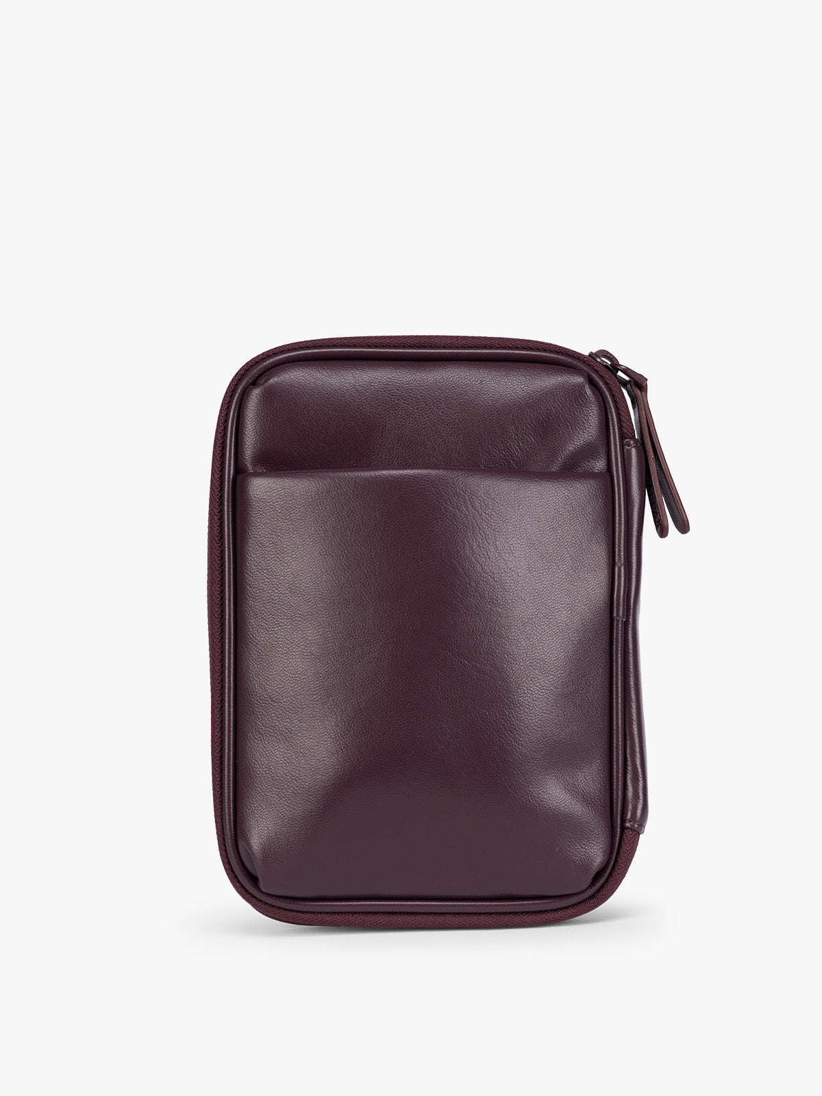 Backside of a deep burgundy Dark Cherry CALPAK Luka Zip Passport Wallet in vegan leather with a zippered top and a front pocket, shown on a plain white background; PZW2301-DARK-CHERRY-PU
