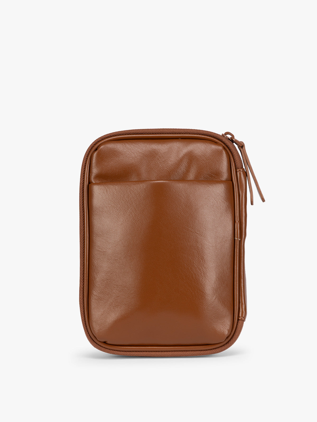 Backside of a light Honey Brown CALPAK Luka Zip Passport Wallet in vegan leather with a zippered top and a front pocket, shown on a plain white background; PZW2301-HONEY-BROWN-PU
