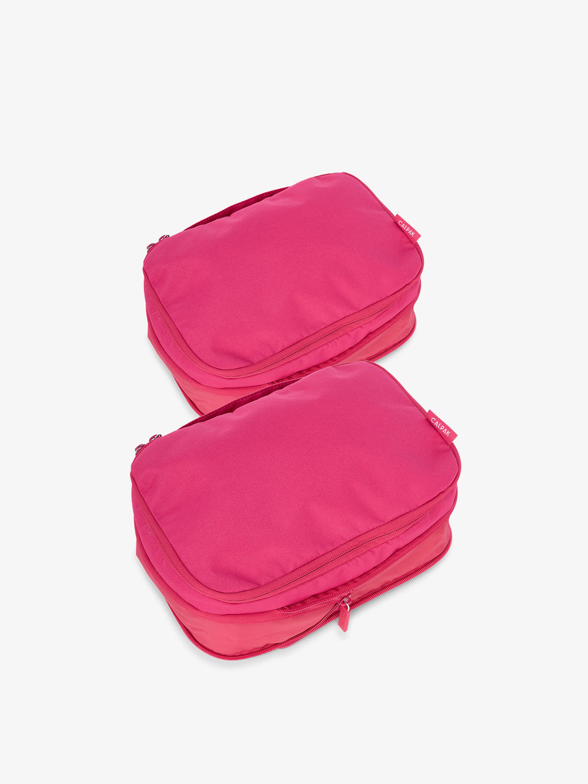 CALPAK small compression packing cubes with top handles and expandable by 4.5 inches in hot pink; PCS2301-DRAGONFRUIT