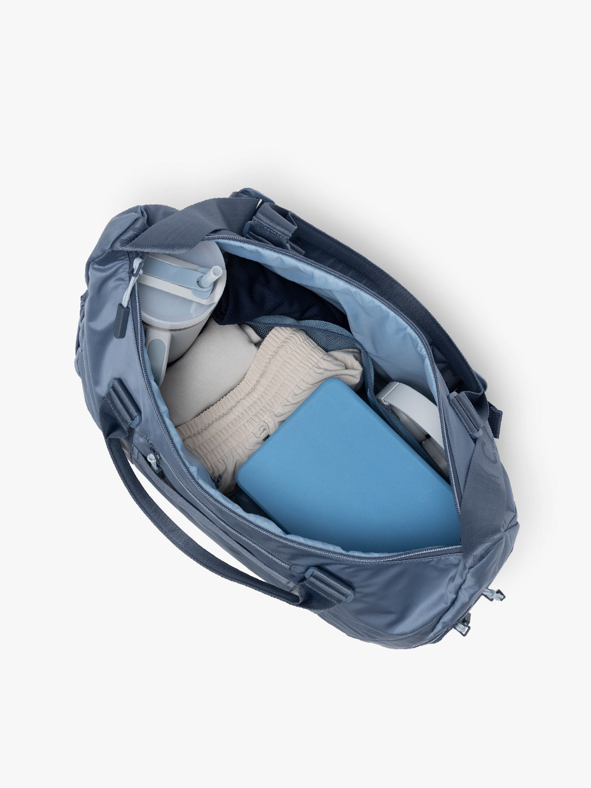 Gym Essentials in the CALPAK Fit Gym Duffel Bag in blue Indigo; TBF2401-INDIGO