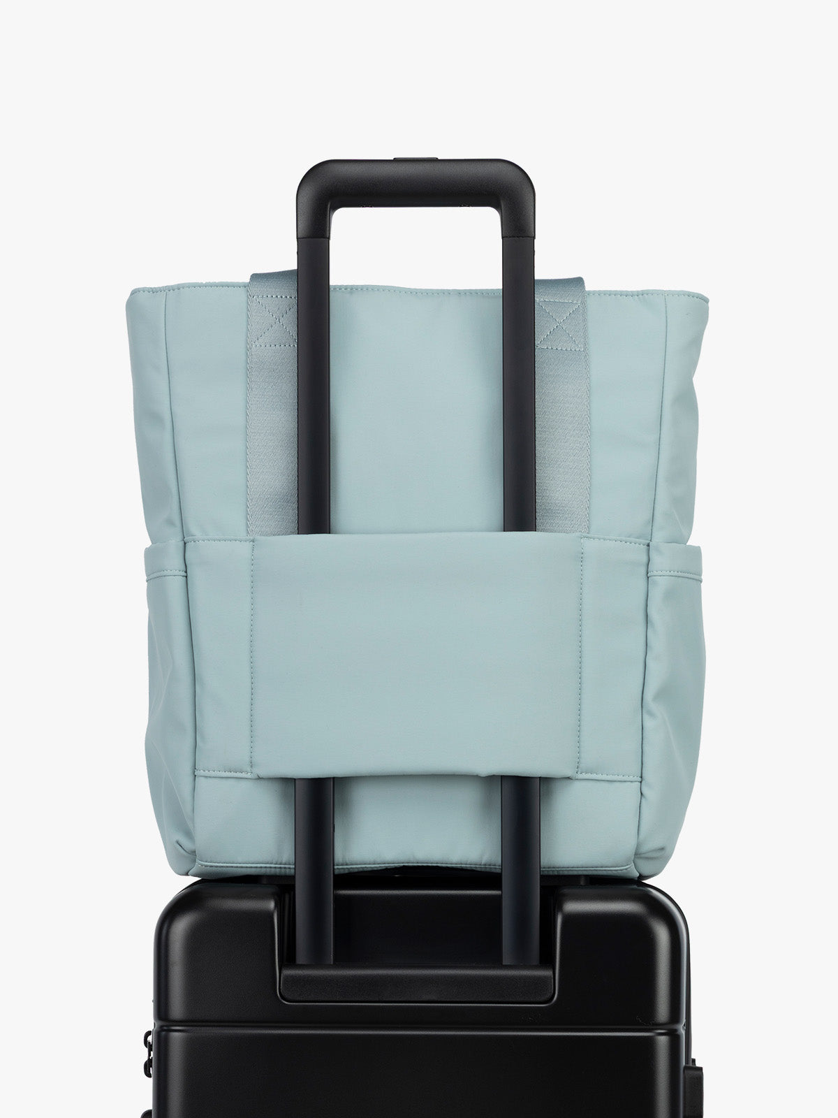CALPAK Zippered Laptop Tote Bag in light blue Bluebell on a white background with trolley sleeve; TCN2501-BLUEBELL