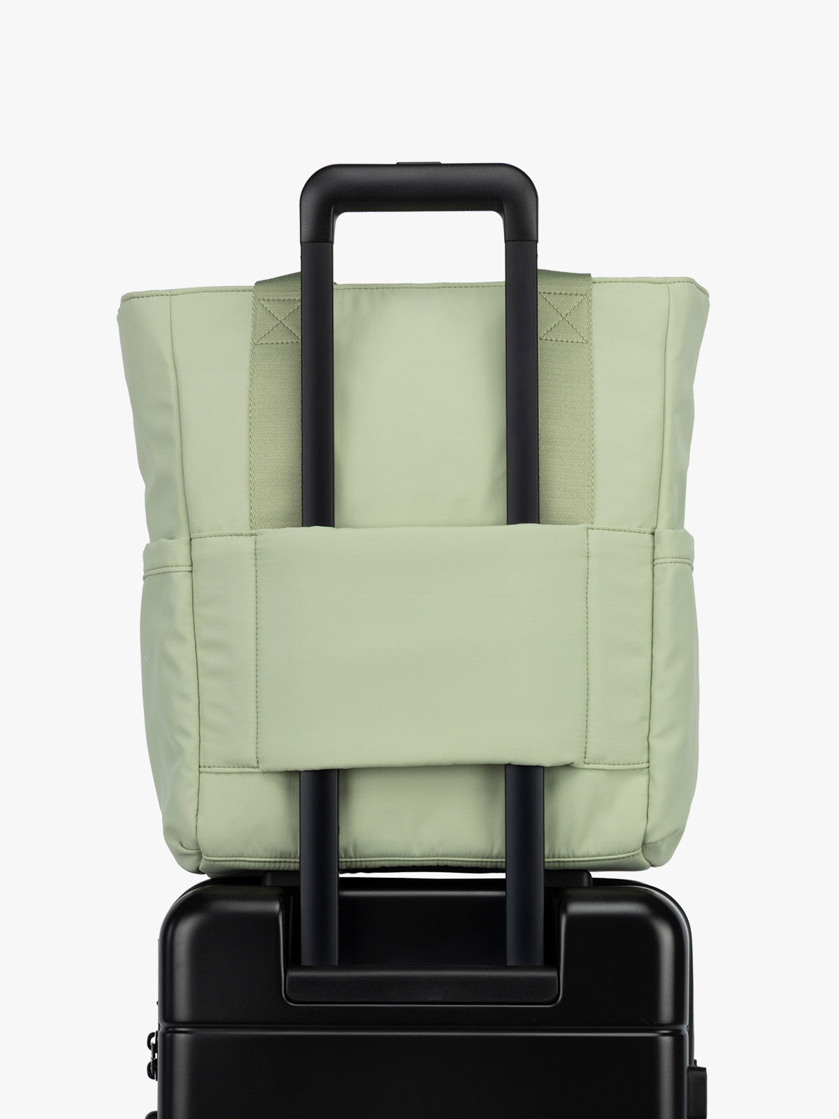 CALPAK Zippered Laptop Tote Bag in light green Meadow on a white background with trolley sleeve; TCN2501-MEADOW