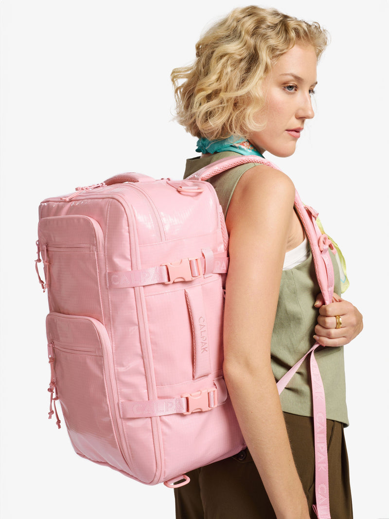 The CALPAK Terra 26L Backpack Duffel in light pink Blossom, shown from a second angle