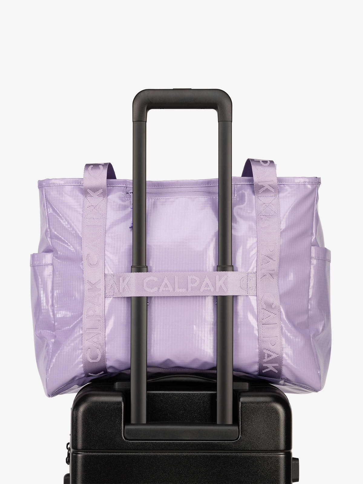 Luggage trolley sleeve of CALPAK Terra 35L Water Resistant Zippered Tote Bag in amethyst; TTO2401-AMETHYST