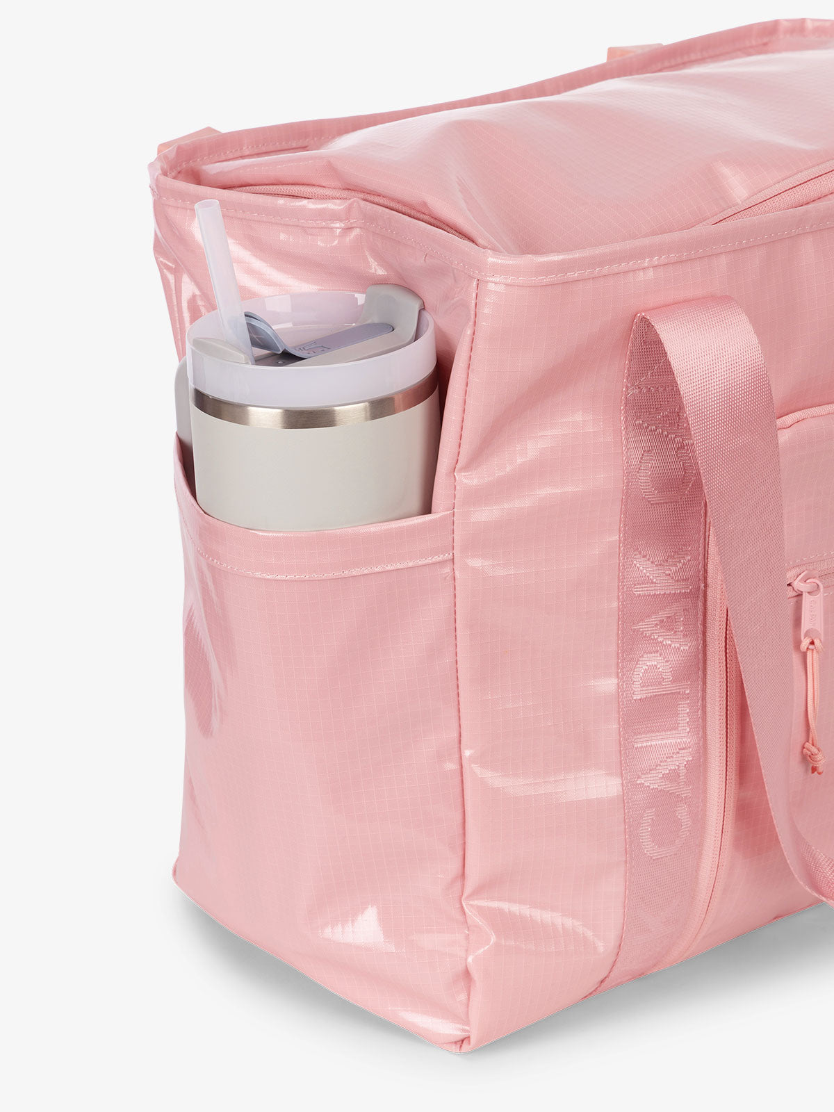 CALPAK Terra 35L Water Resistant Zippered Tote Bag with exterior side pocket that can fit large water bottle in pink; TTO2401-BLOSSOM