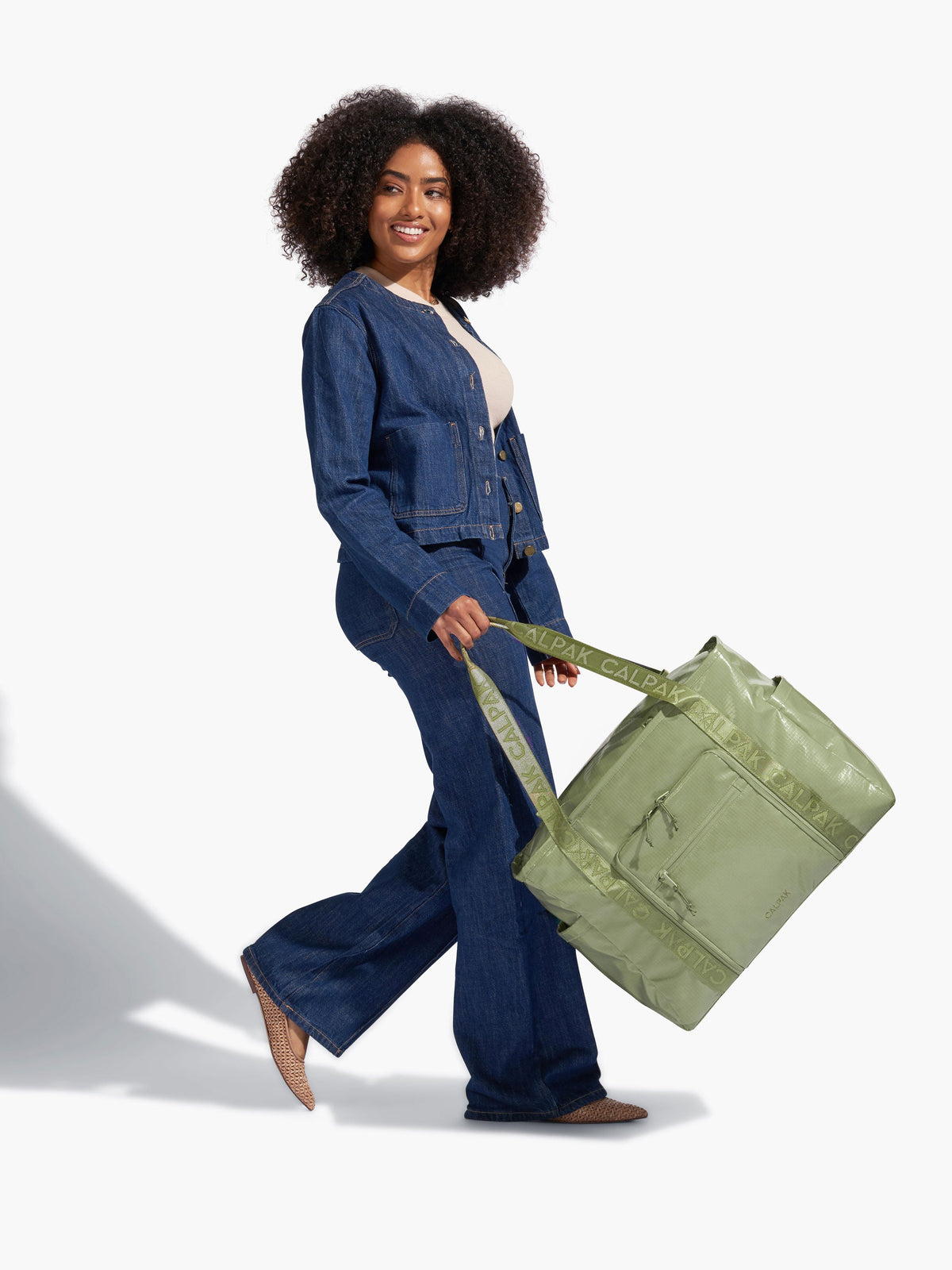 CALPAK Terra 35L Water Resistant Zippered Tote Bag made with durable recycled ripstop exterior, nylon webbing tote straps and multiple exterior pockets in juniper; TTO2401-JUNIPER