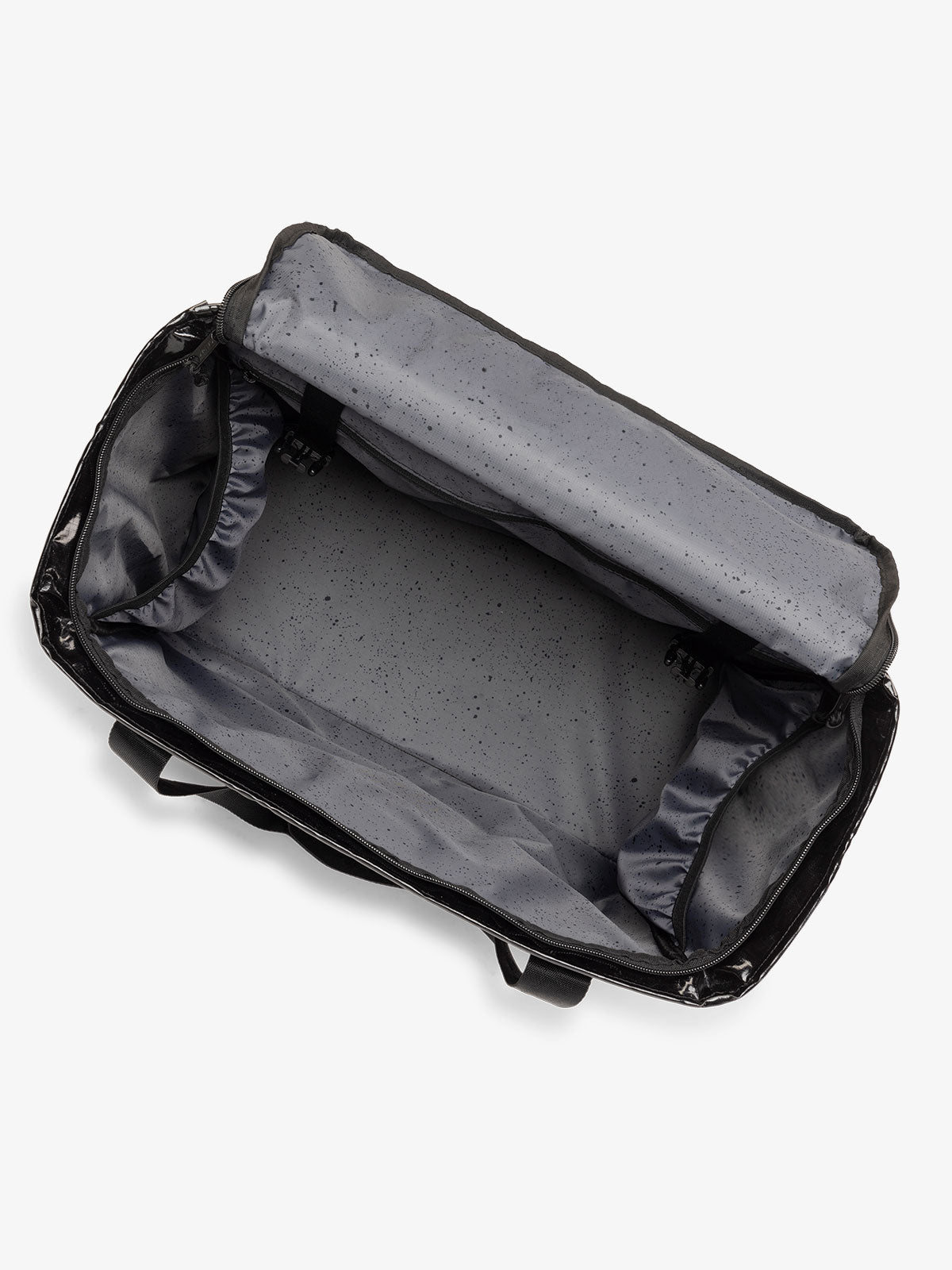 CALPAK Terra 35L Water Resistant Zippered Tote Bag with water resistant lining and multiple interior pockets in black; TTO2401-OBSIDIAN