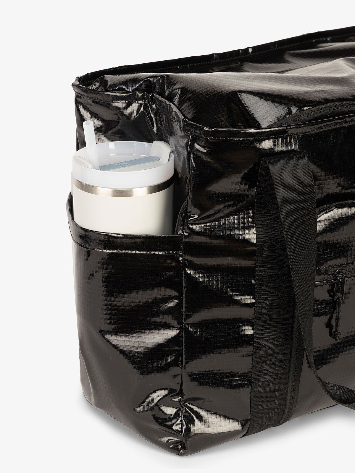 CALPAK Terra 35L Water Resistant Zippered Tote Bag with exterior side pocket that can fit large water bottle in obsidian black; TTO2401-OBSIDIAN