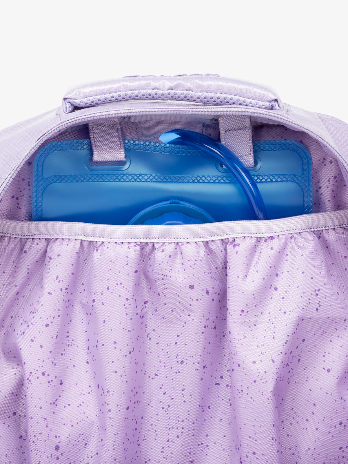 Close up of CALPAK 2L removable hydration reservoir back-slip pocket in orange; BPT2201-AMETHYST
