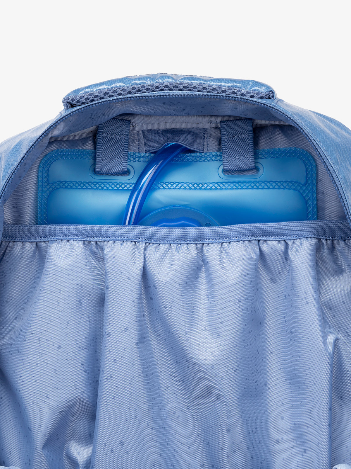 Close up of CALPAK 2L removable hydration reservoir back-slip pocket in blue; BPT2201-GLACIER
