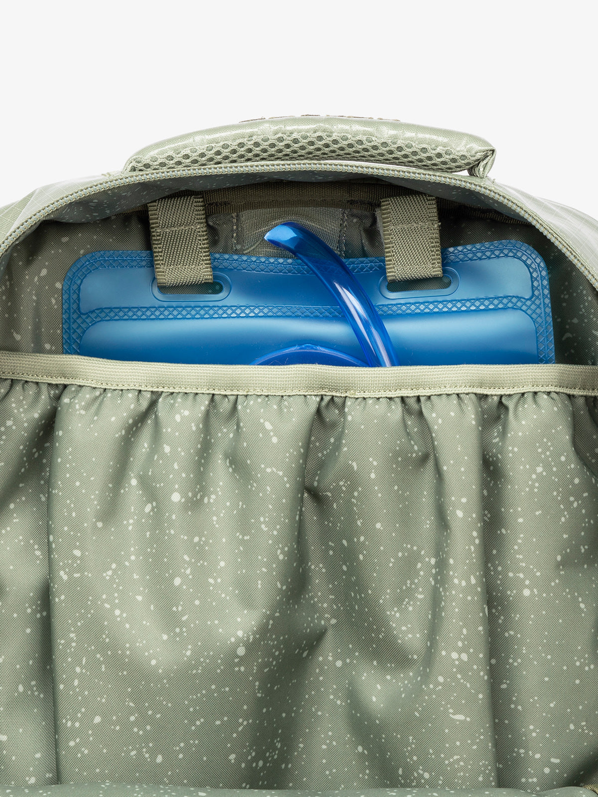Close up of CALPAK 2L removable hydration reservoir pocket in green; BPT2201-JUNIPER