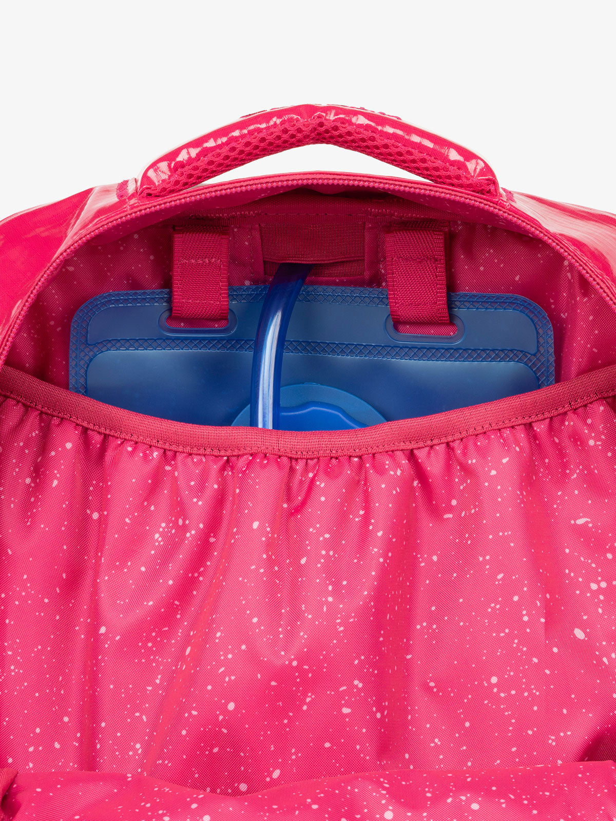 Close up of CALPAK 2L removable hydration reservoir back-slip pocket in pink dragonfruit; BPT2201-DRAGONFRUIT