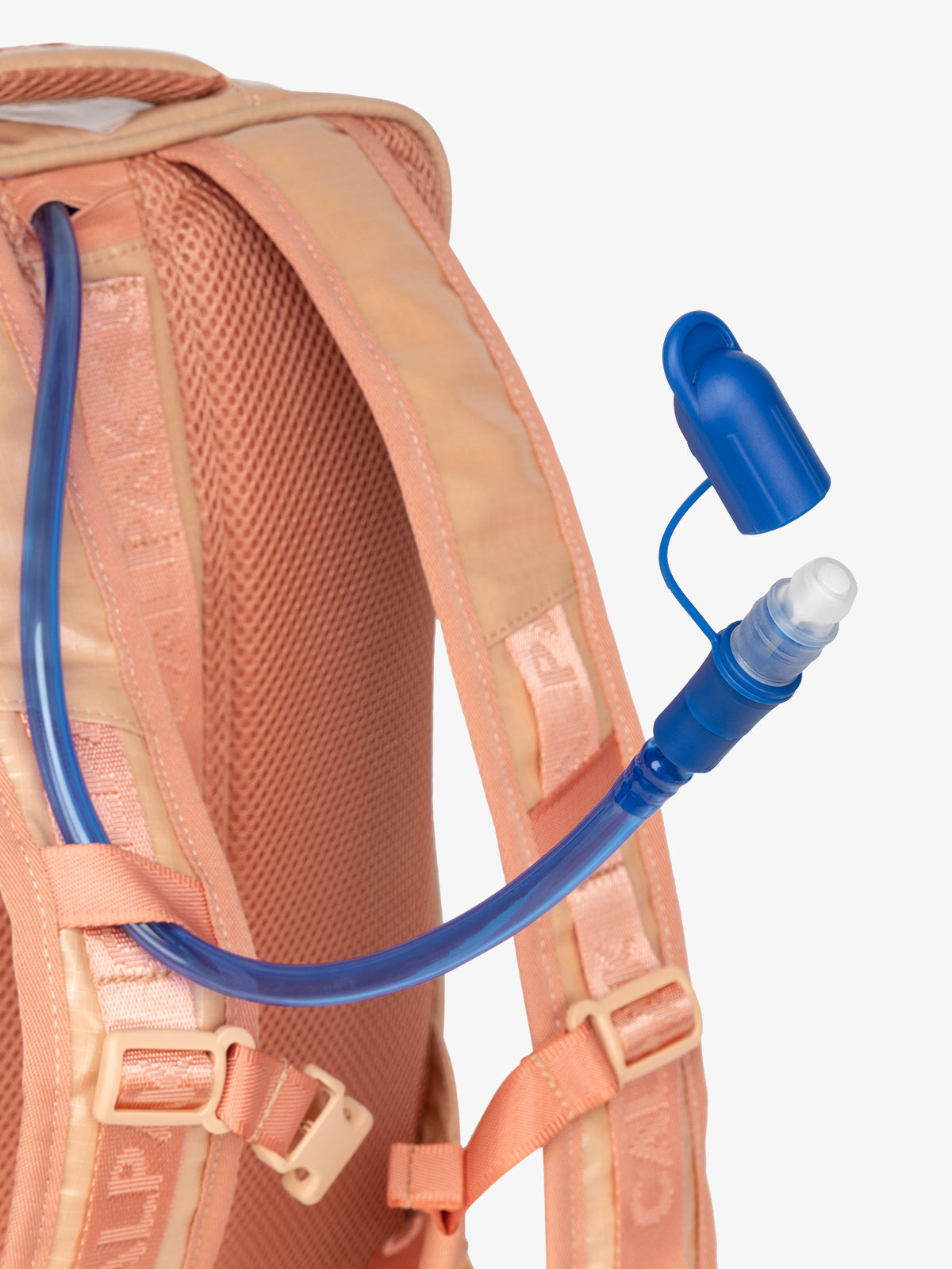 Close up of removable CALPAK hydration reservoir straw featuring valve cap in canyon; BPT2201-CANYON