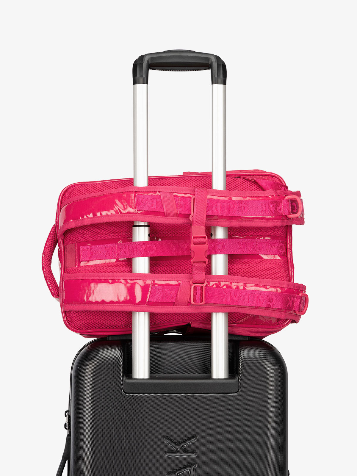 CALPAK hydration backpack with luggage trolley strap and and adjustable shoulder straps in pink; BPT2201-DRAGONFRUIT
