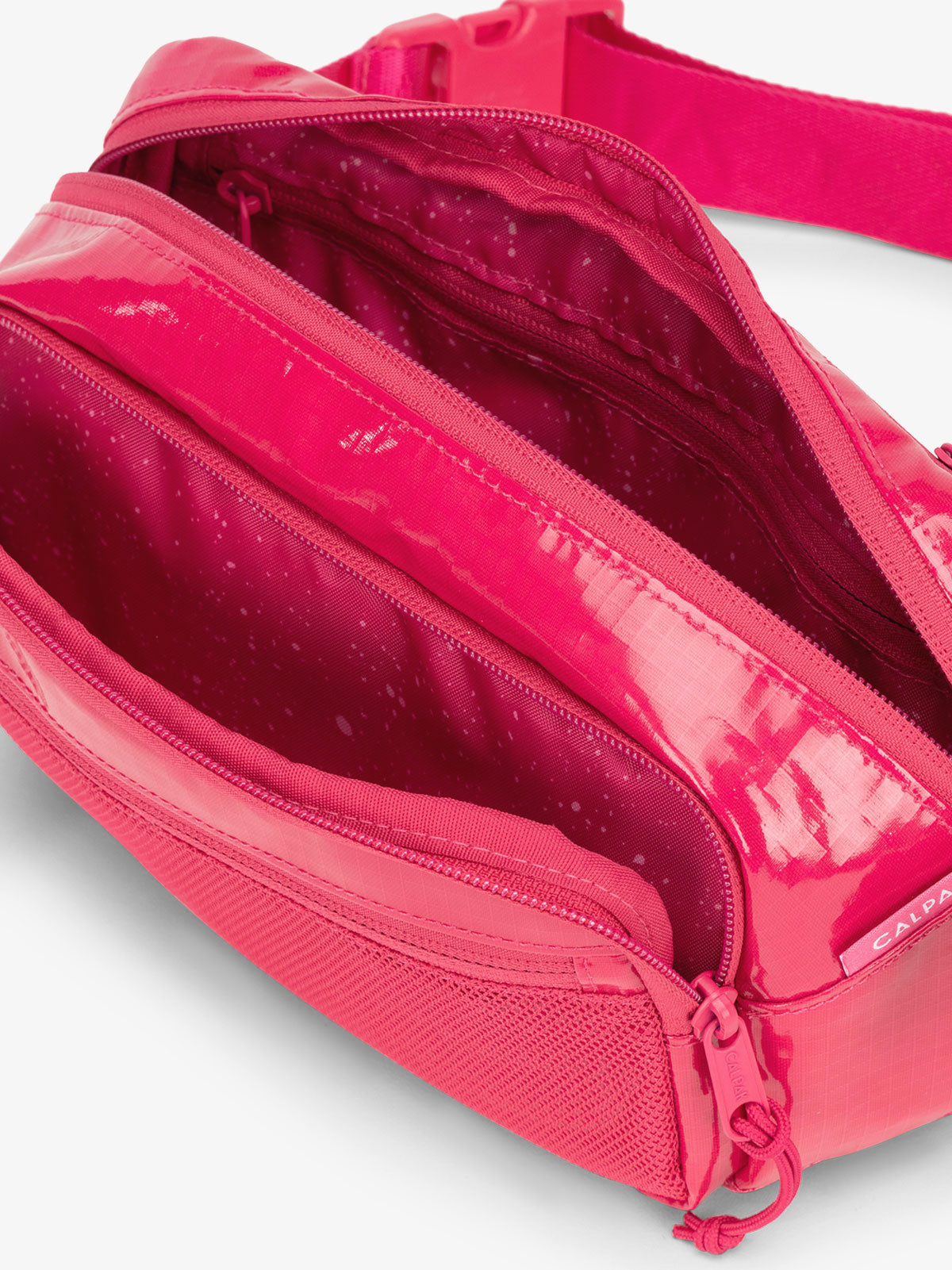 CALPAK Terra hiking belt bag with multiple interior pockets and water resistant exterior in dragonfruit pink; BBT2301-DRAGONFRUIT