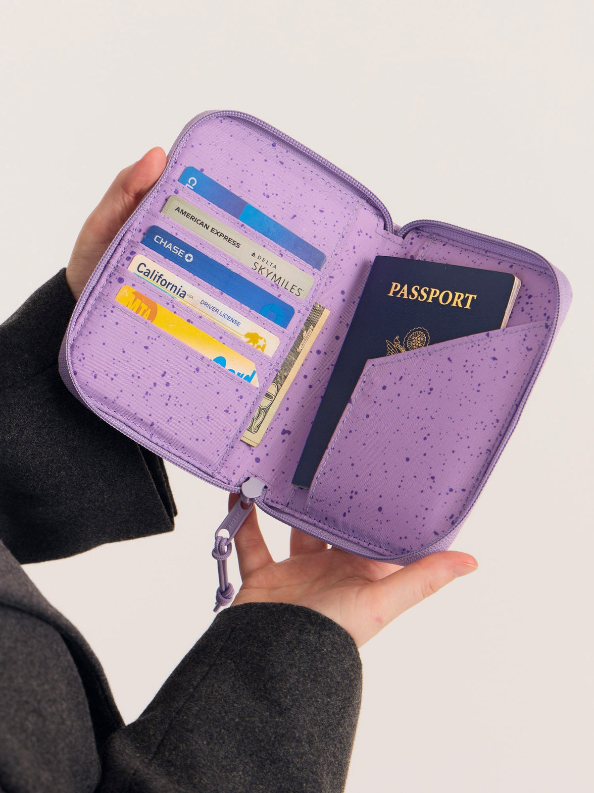CALPAK Terra Zippered Passport Wallet in Amethyst light purple opened view with cards and passport; ATPW2501-AMETHYST