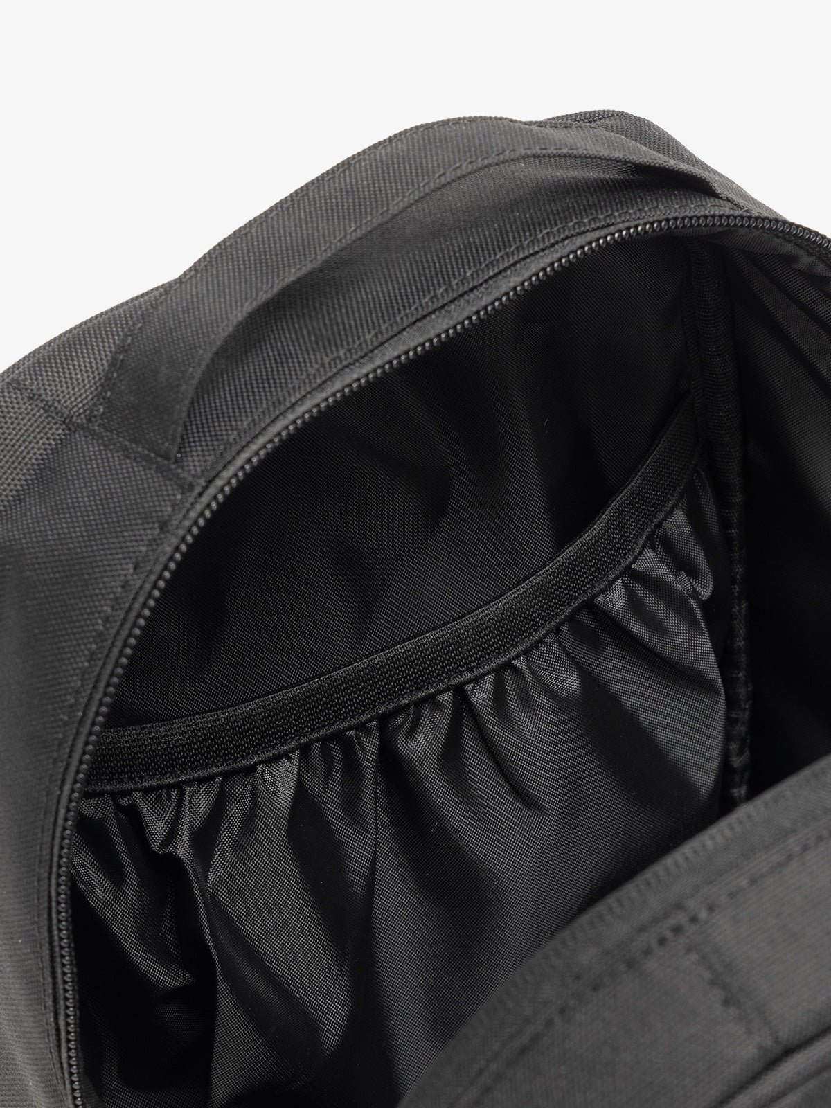 CALPAK The Everything Cube with multiple interior pockets and water resistant lining in black; ACE2401-BLACK