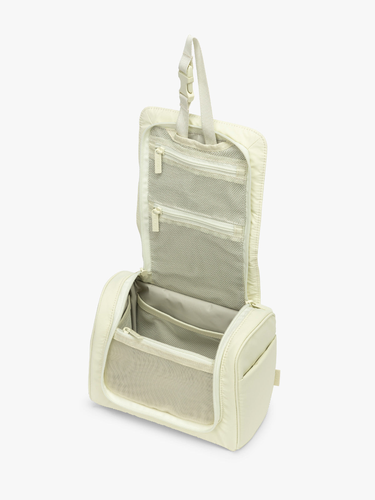 Opened CALPAK Luka Hanging Toiletry Bag in light green Celadon; TLH2301-CELADON