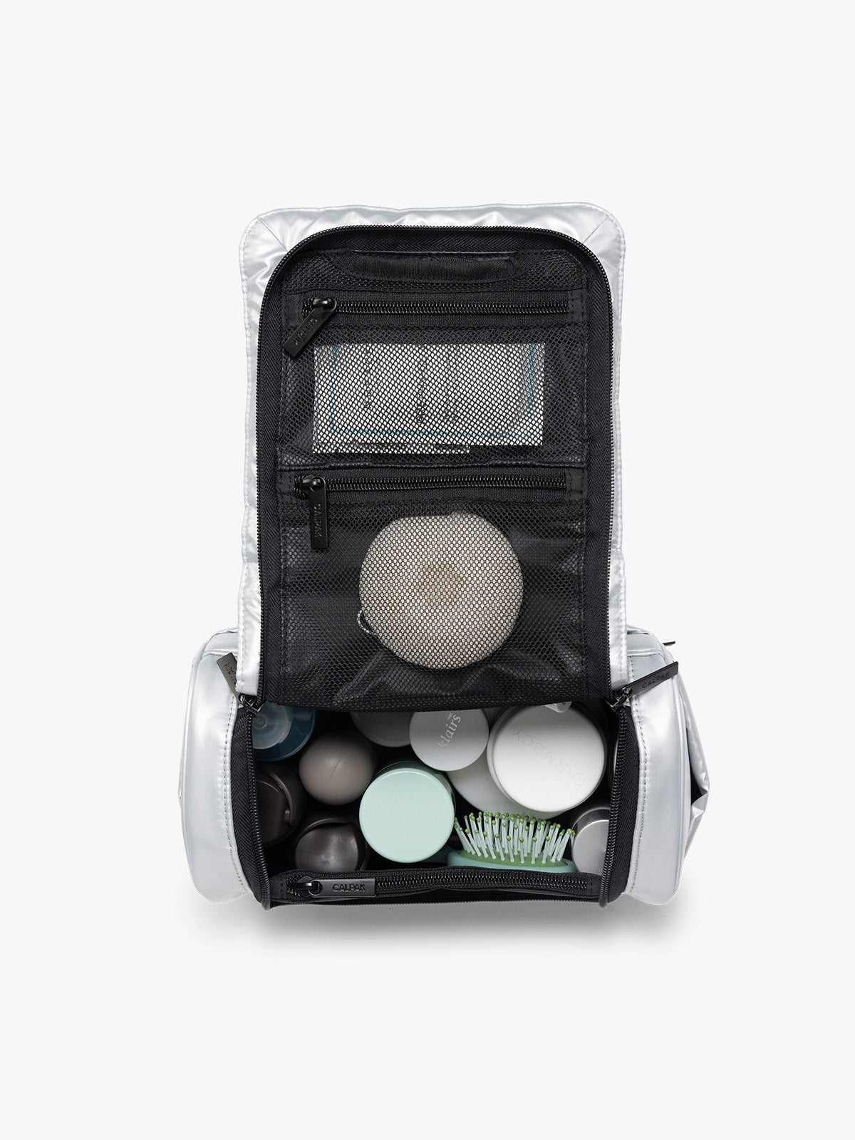 Items in the CALPAK Luka Hanging Toiletry Bag in Silver; TLH2301-SILVER