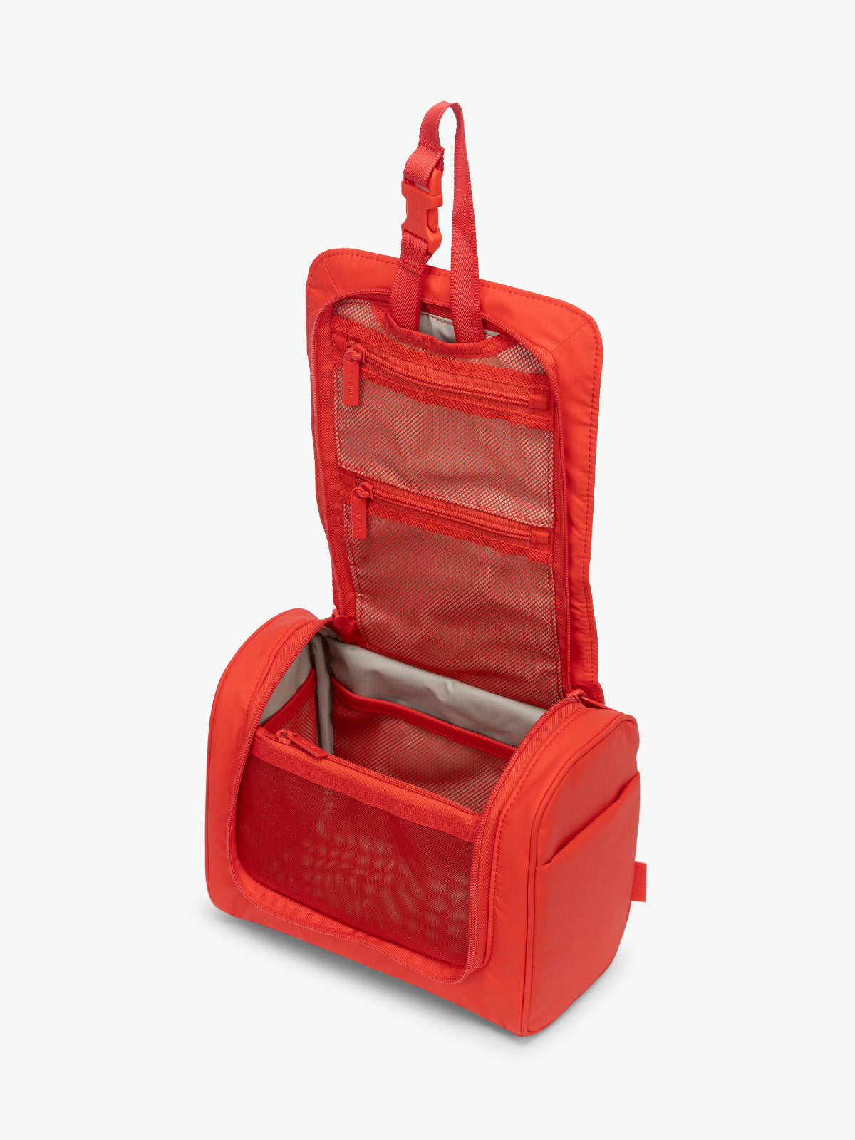 Opened CALPAK Luka Hanging Toiletry Bag in red Tomato; TLH2301-TOMATO