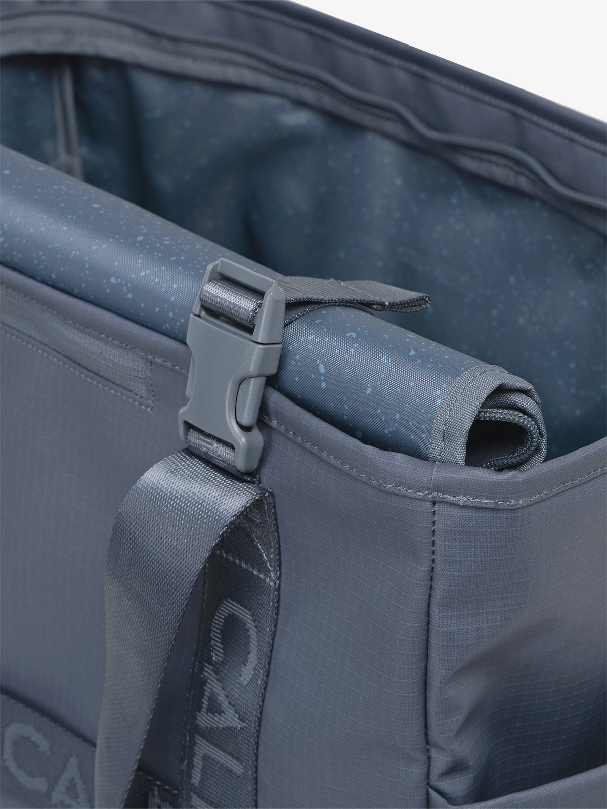 CALPAK Terra 35L Water Resistant Zippered Tote Bag in blue Matte Indigo strap detail; TTO2401-INDIGO