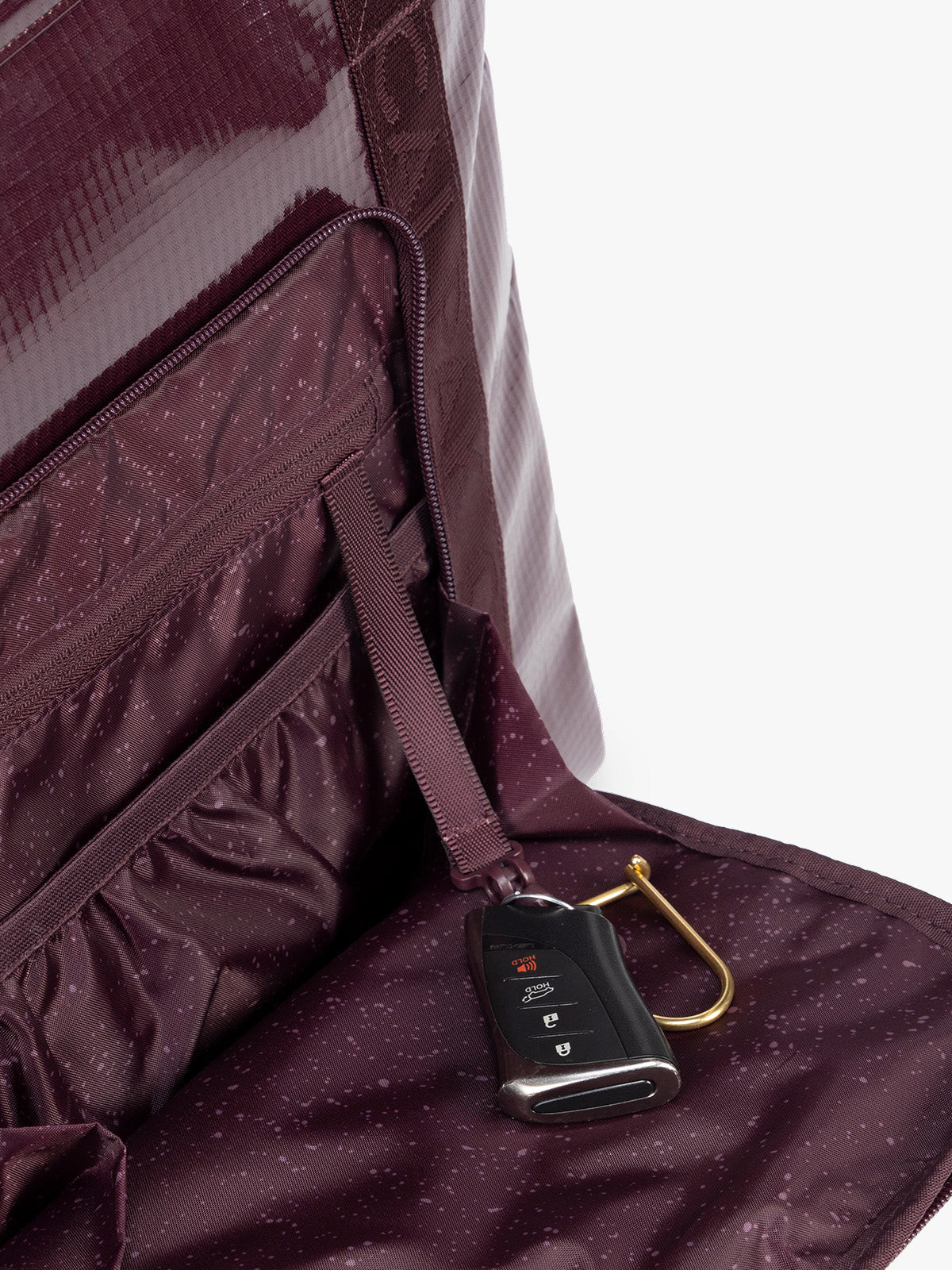 Key line of CALPAK Terra 35L Tote Bag with zippers in dark red Dark Cherry on a white background; TTO2401-DARK-CHERRY