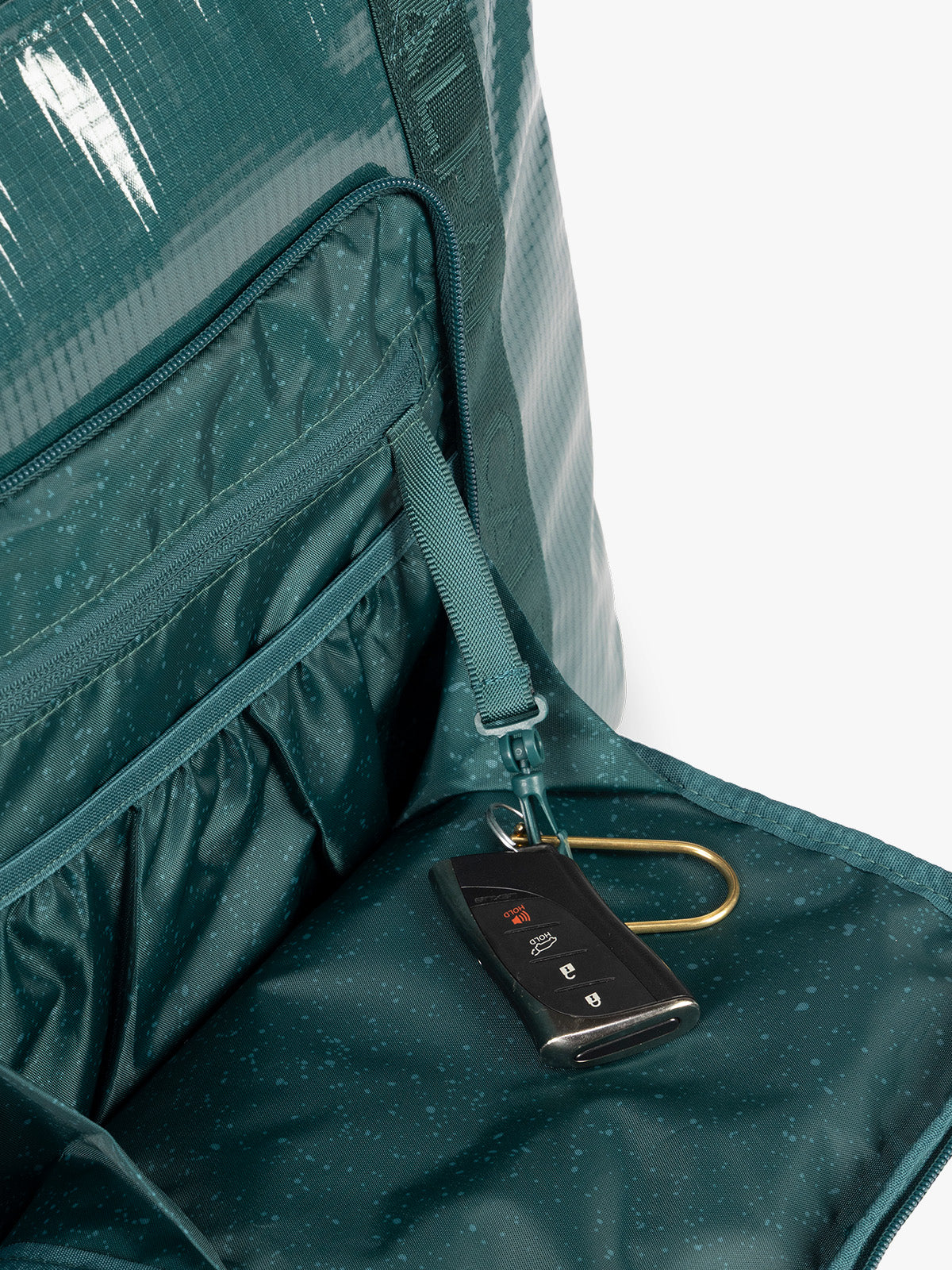 Key line of CALPAK Terra 35L Tote Bag with zippers in blue green Kale on a white background; TTO2401-KALE