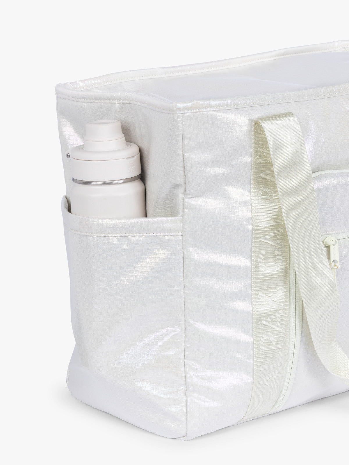 Side water bottle holder of CALPAK Terra 35L Tote Bag with multiple pockets and shoulder straps in shiny white Moonbeam on a white background; TTO2401-MOONBEAM