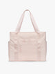 CALPAK Terra 35L Tote Bag with multiple pockets and shoulder straps in shiny light pink Shell Pink on a white background; TTO2401-SHELL-PINK