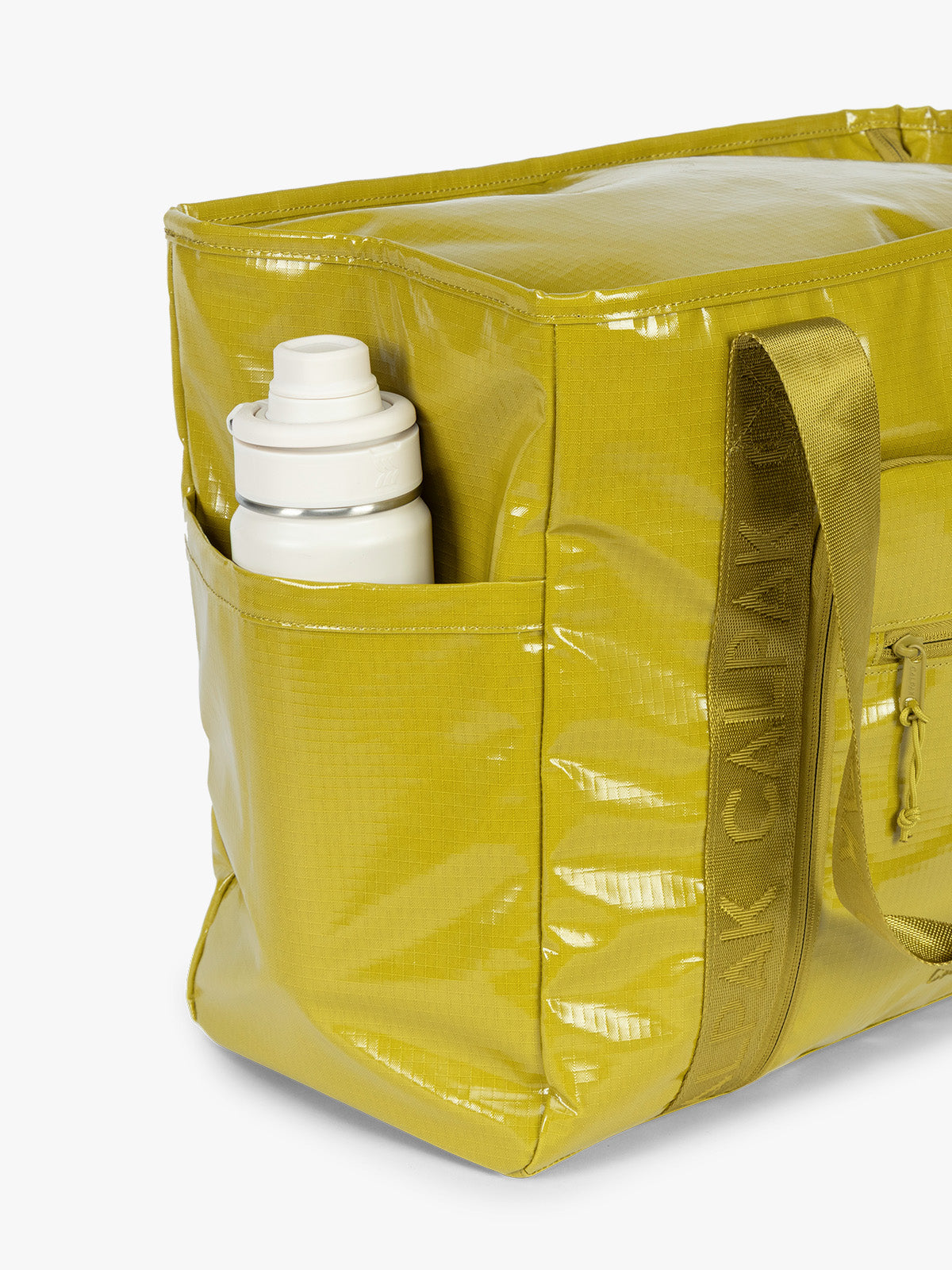 Side water bottle holder of CALPAK Terra 35L Tote Bag with zippers in yellow green Wasabi on a white background; TTO2401-WASABI
