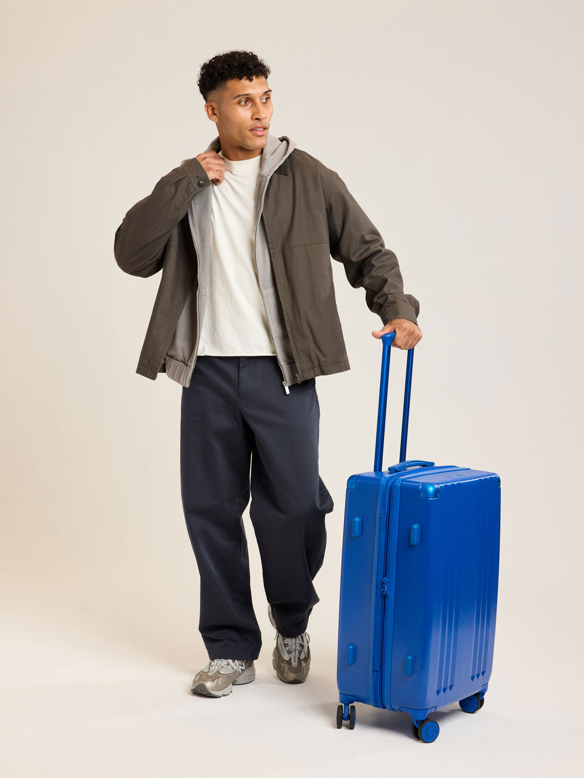 Model with CALPAK Ambeur Medium Luggage in dark blue Cobalt; LAM1024-COBALT