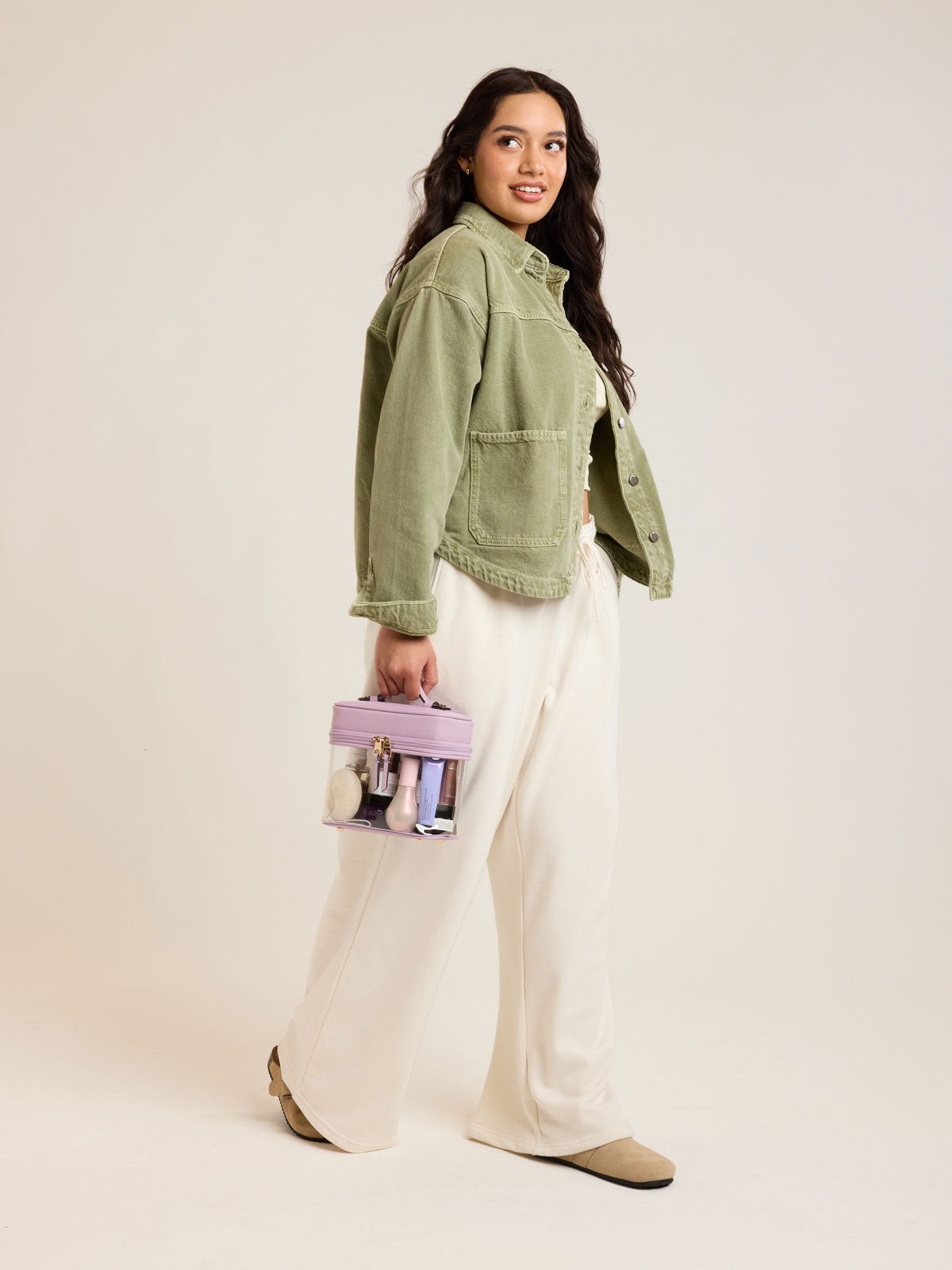 Model with CALPAK Clear Train Case in purple lavender; CTC2401-LAVENDER