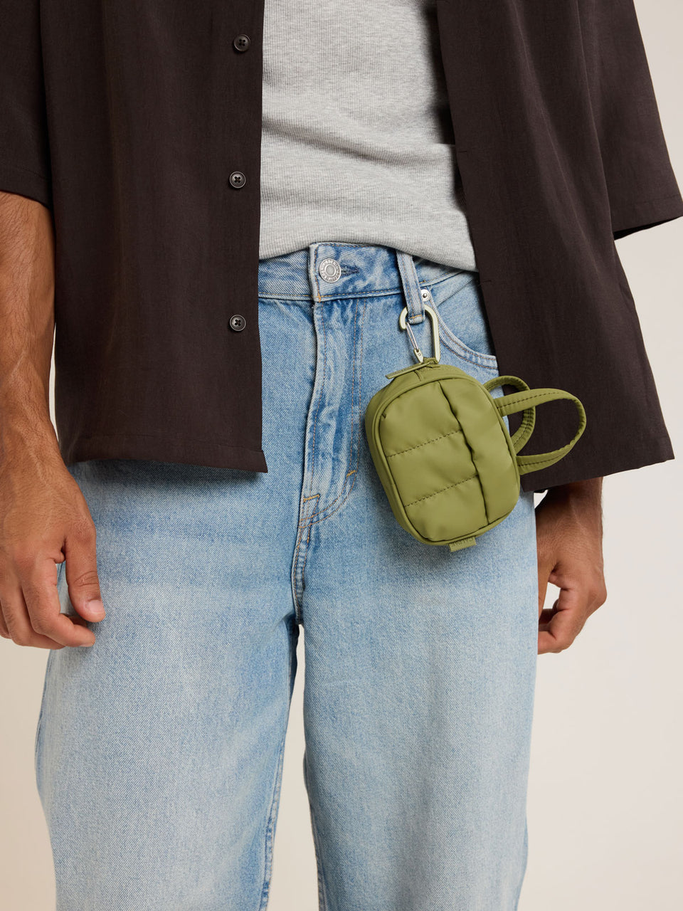 Model with attached CALPAK Luka Duffel Zip Bag Charm in green Pistachio; ALK2501-PISTACHIO