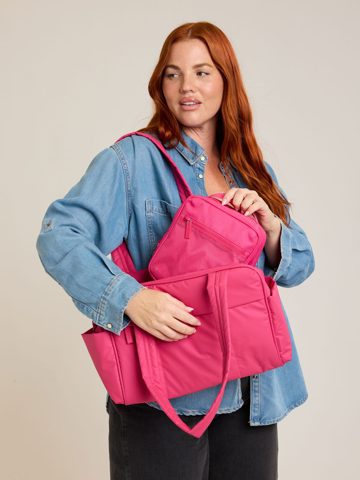 Model with CALPAK Everything Cube in bright pink Dragonfruit; ACE2401-DRAGONFRUIT