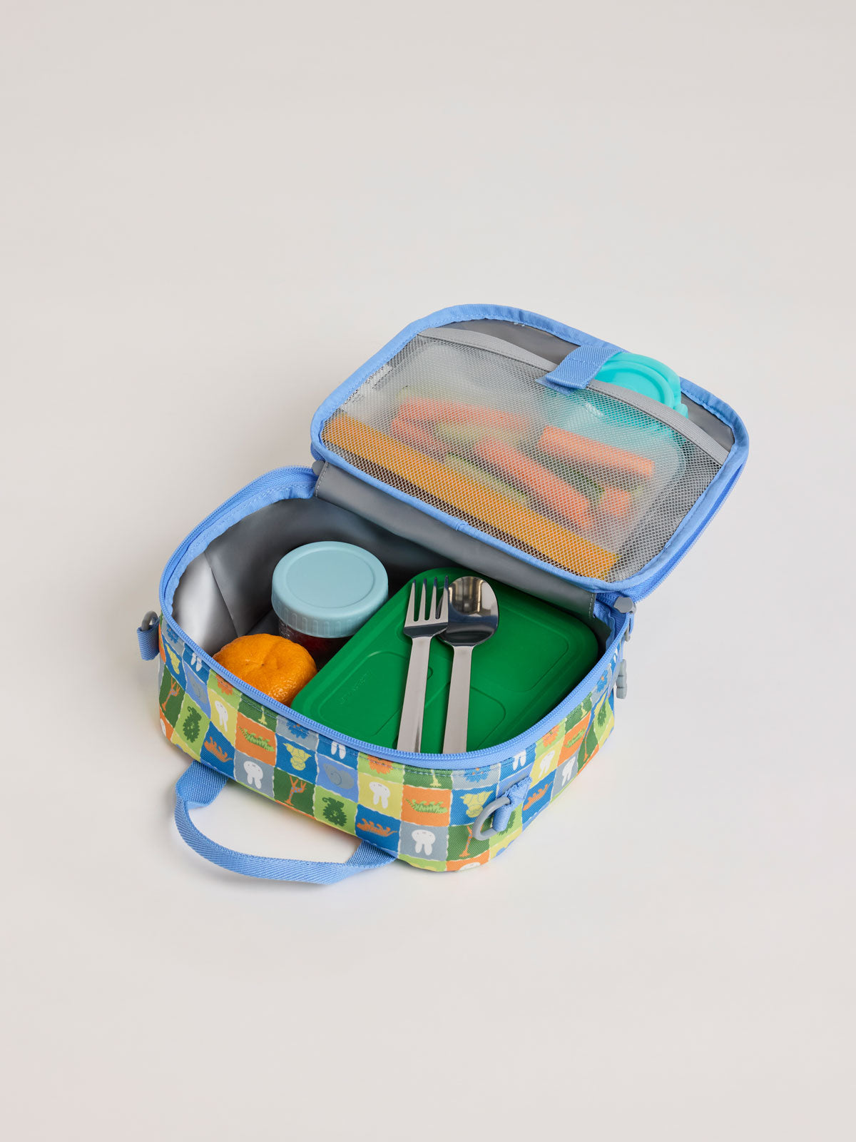Opened side of CALPAK Kids Lunch Bag with Miffy and animal pattern with mesh front pocket and top handles on a white background; CKLB2501-MIFFY-BLUE-ZOO-TRIP