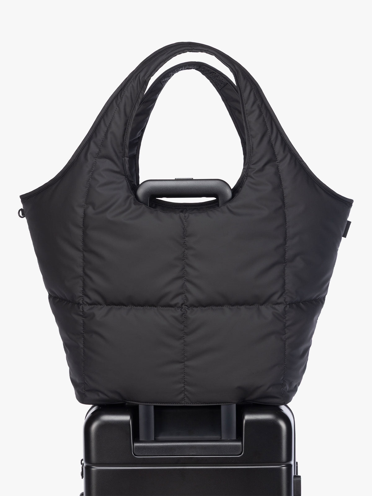 Luggage trolley sleeve of CALPAK Luka Everything Tote in black; AET2601-MATTE-BLACK