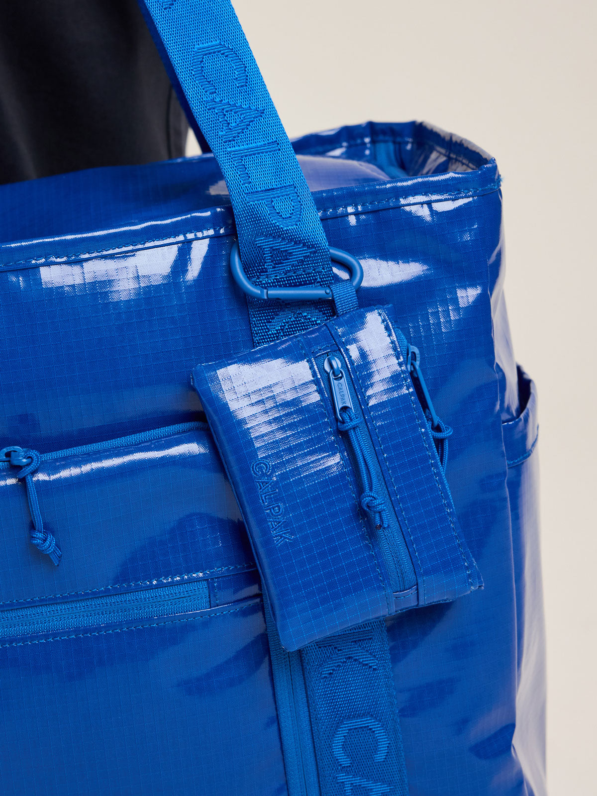 CALPAK Terra Clippable Card Pouch in blue Cobalt clipped on bag; TPC2401-COBALT