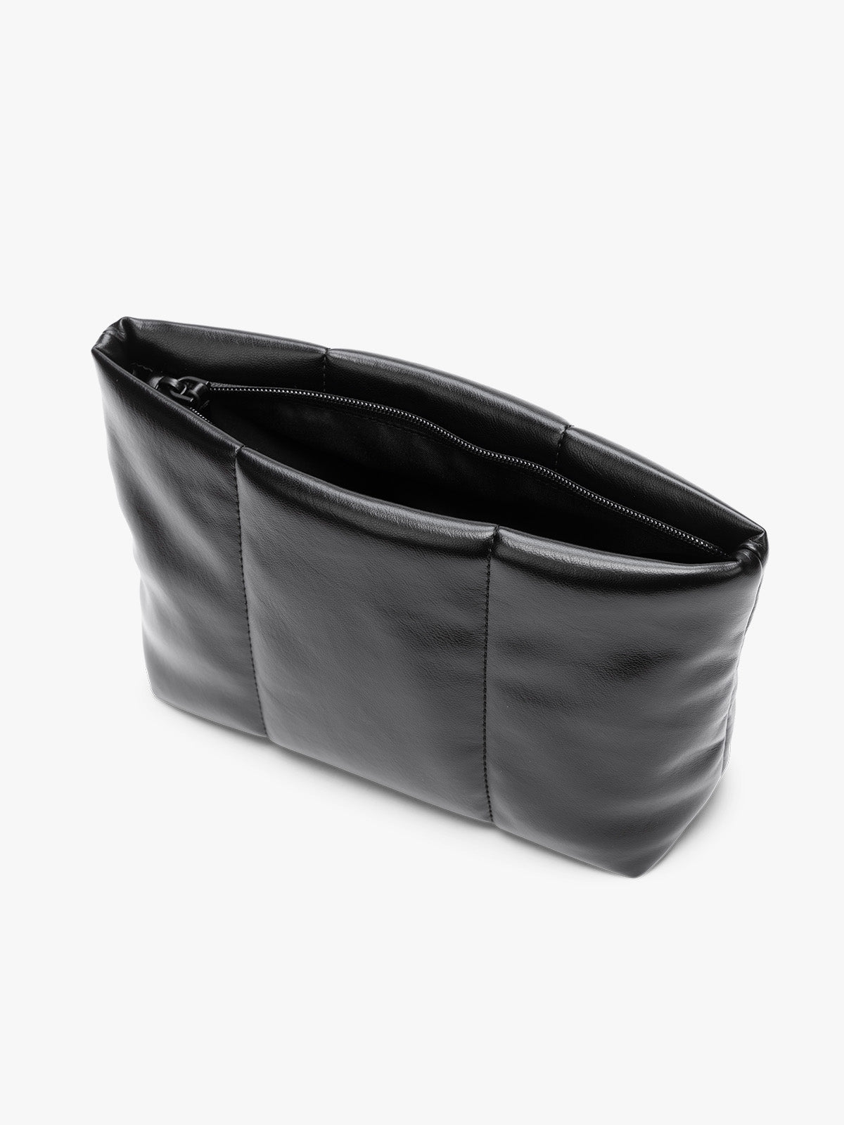 Opened zipper of CALPAK black vegan leather pouch bag with a structured rectangular shape and vertical stitched panel details, shown against a plain white background; ZLPM2601-BLACK-PU