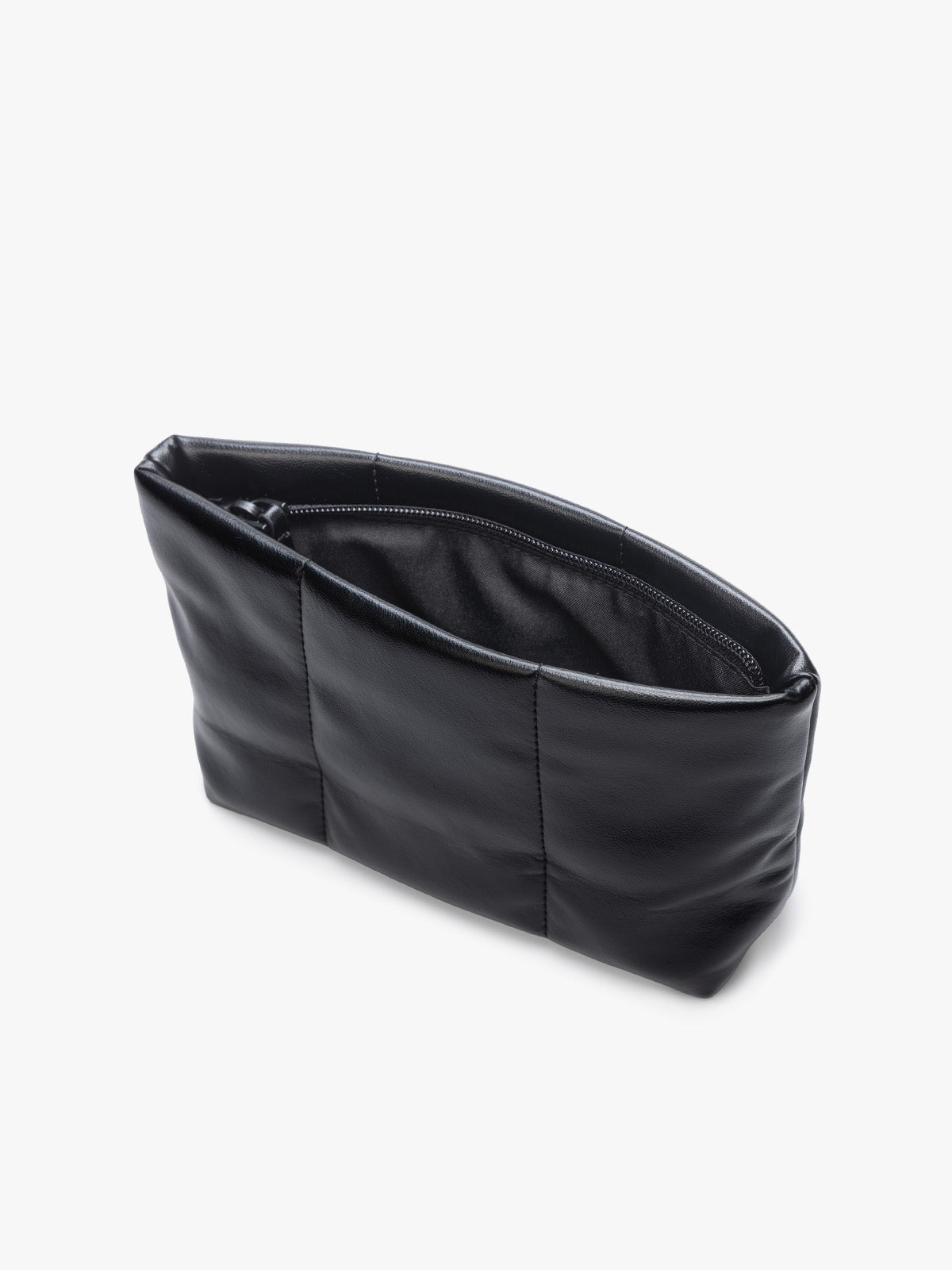 Opened zipper of a CALPAK Luka 1 quart black vegan leather pouch bag with a quilted, padded design and a small black brand tag on the right side, shown against a plain white background; ZLPS2601-BLACK-PU