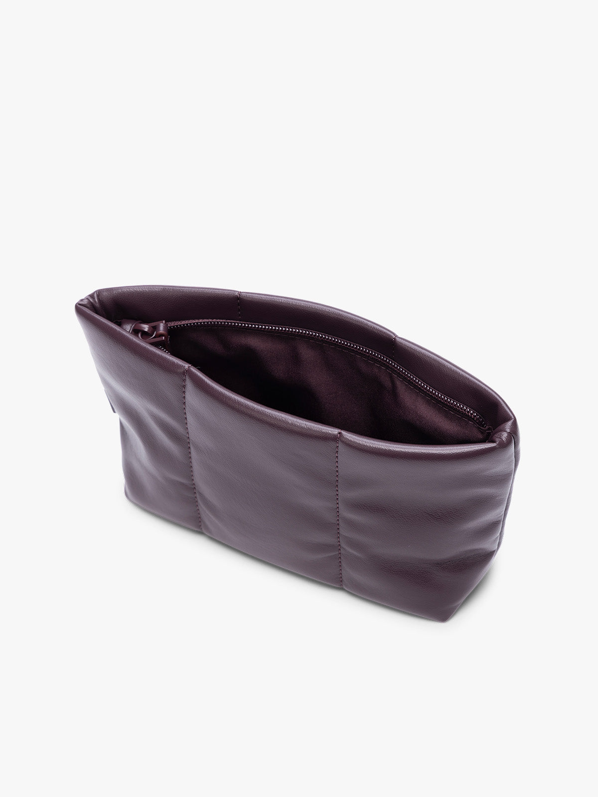 Opened zipper of a CALPAK Luka 1 quart deep plum Dark Cherry vegan leather pouch bag with a quilted, padded design and a small brand tag on the right side, shown against a plain white background; ZLPS2601-DARK-CHERRY-PU